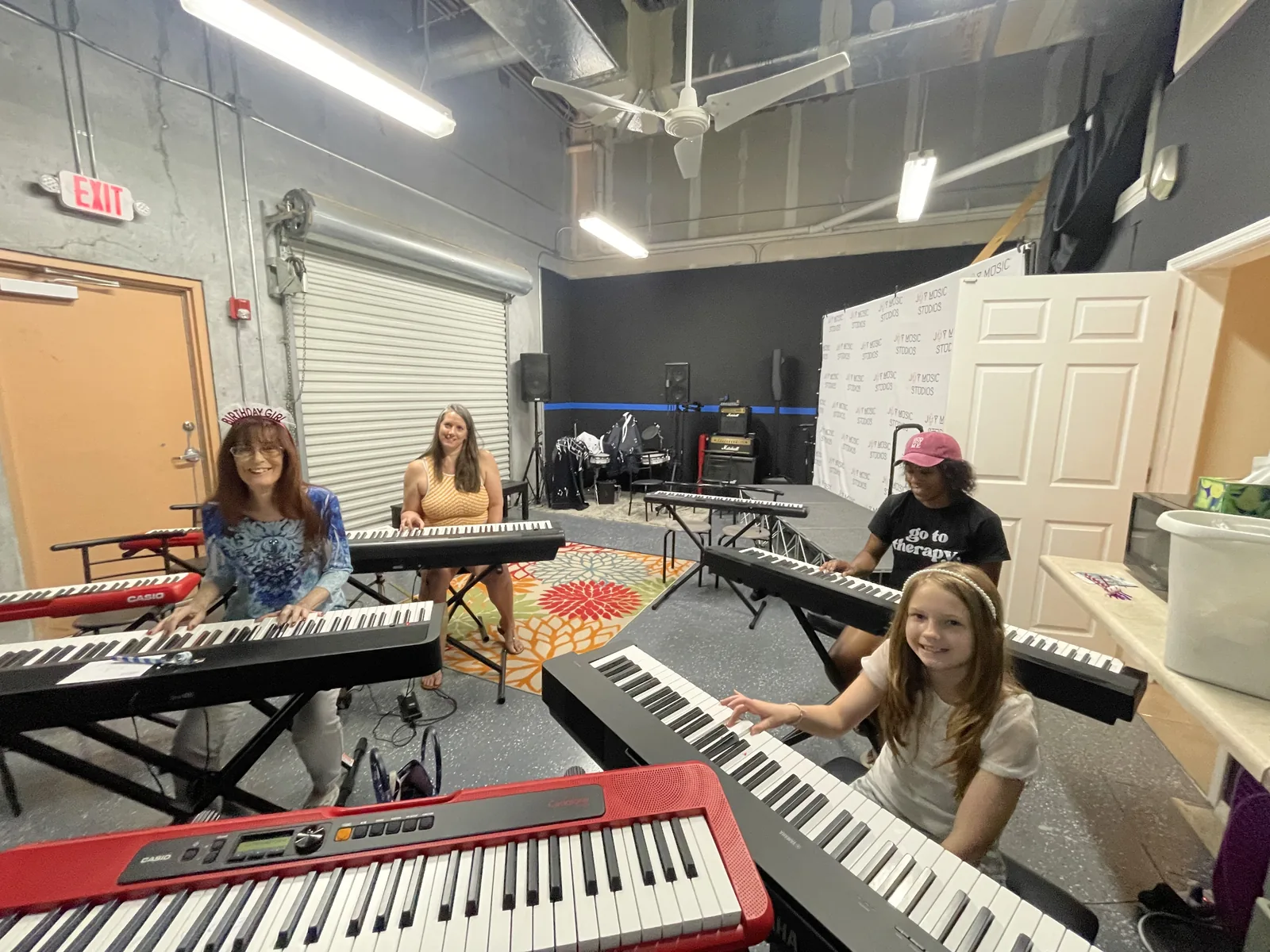Students practicing at keyboards in the studio classroom